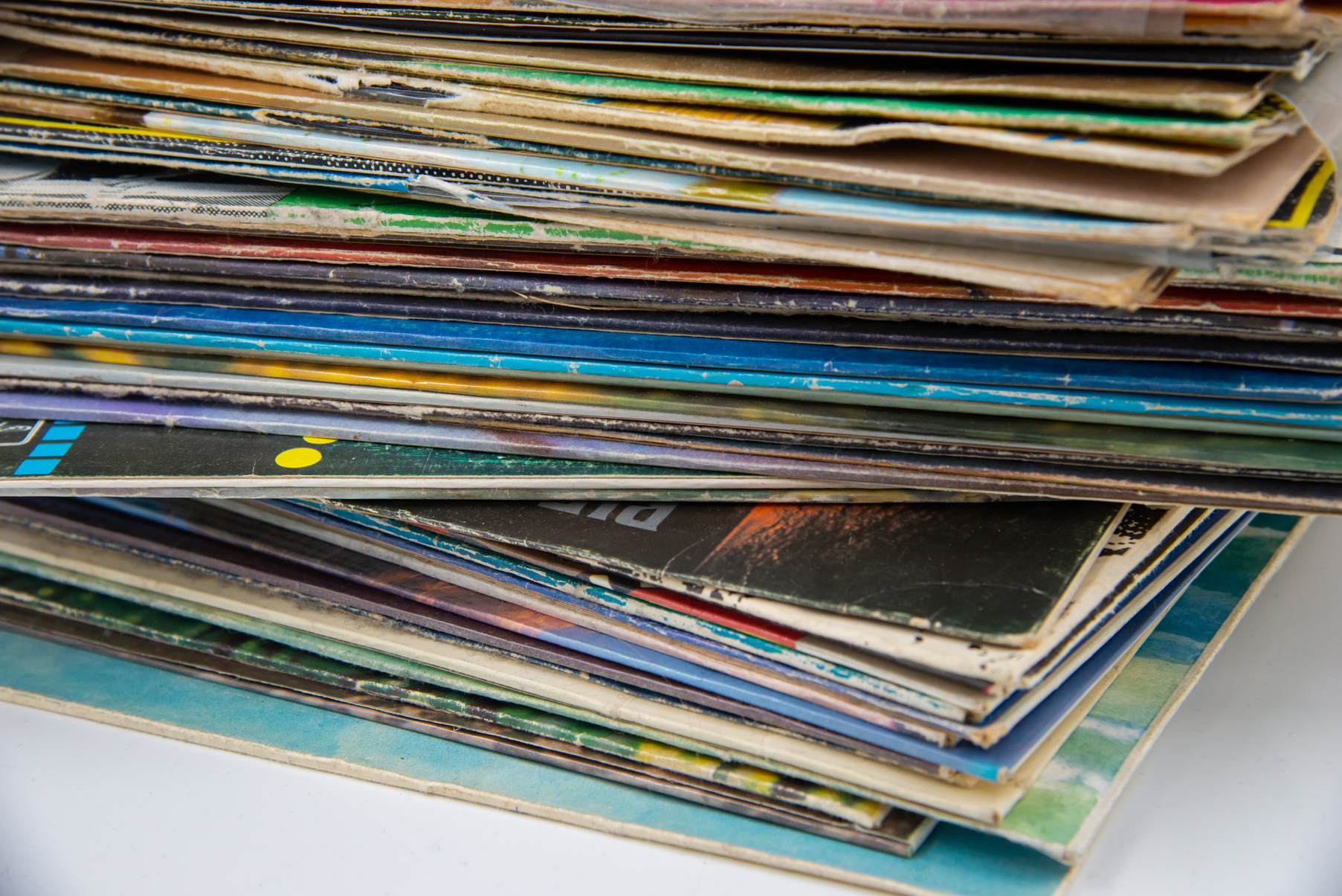 Group of old vinyl singles in original sleeves, 7 inches records covers.